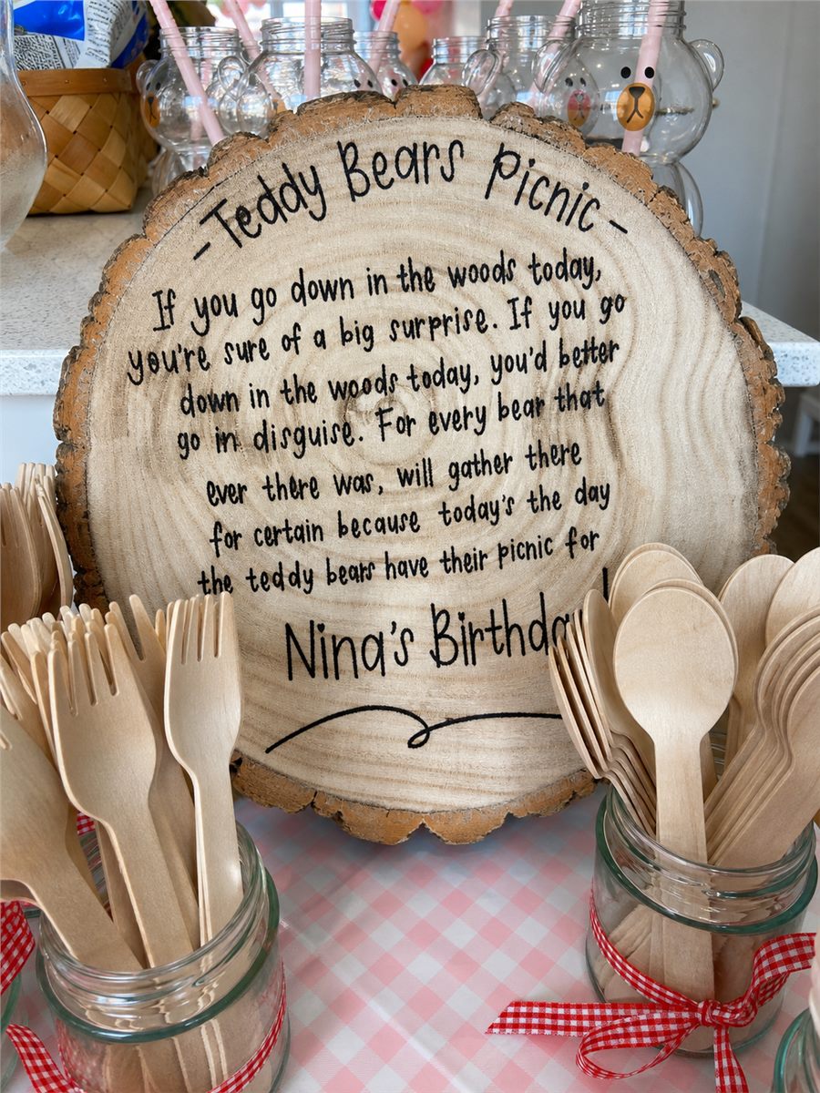 Wooden teddy bears picnic party sign with outdoor styling.